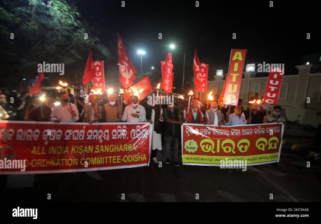 Supporters and other trade union activists are seen on the road in the eastern Indian state Odisha's capital city Bhubaneswar, India, on December 11, 2020 as they stage protest for farmers, continuing their protest against the government's farm bill in all over the country. (Photo by STR/NurPhoto) Stock Photo