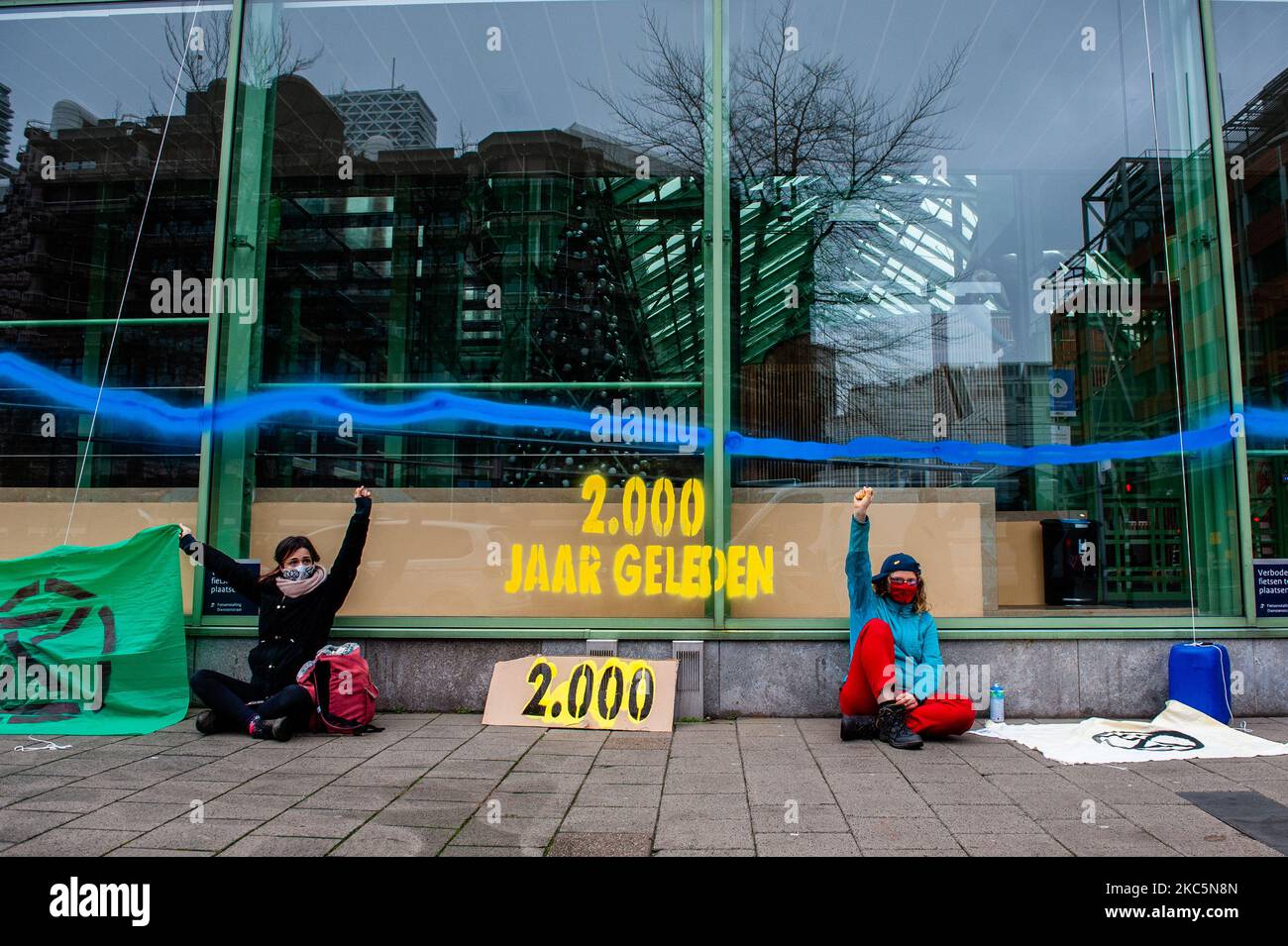 Extinction Rebellion activists are sitting in front of the Ministry of Economic Affairs and Climate Policy building, in the Hague, where the activists hung a huge banner warming about climate change, on December 12th, 2020. (Photo by Romy Arroyo Fernandez/NurPhoto) Stock Photo