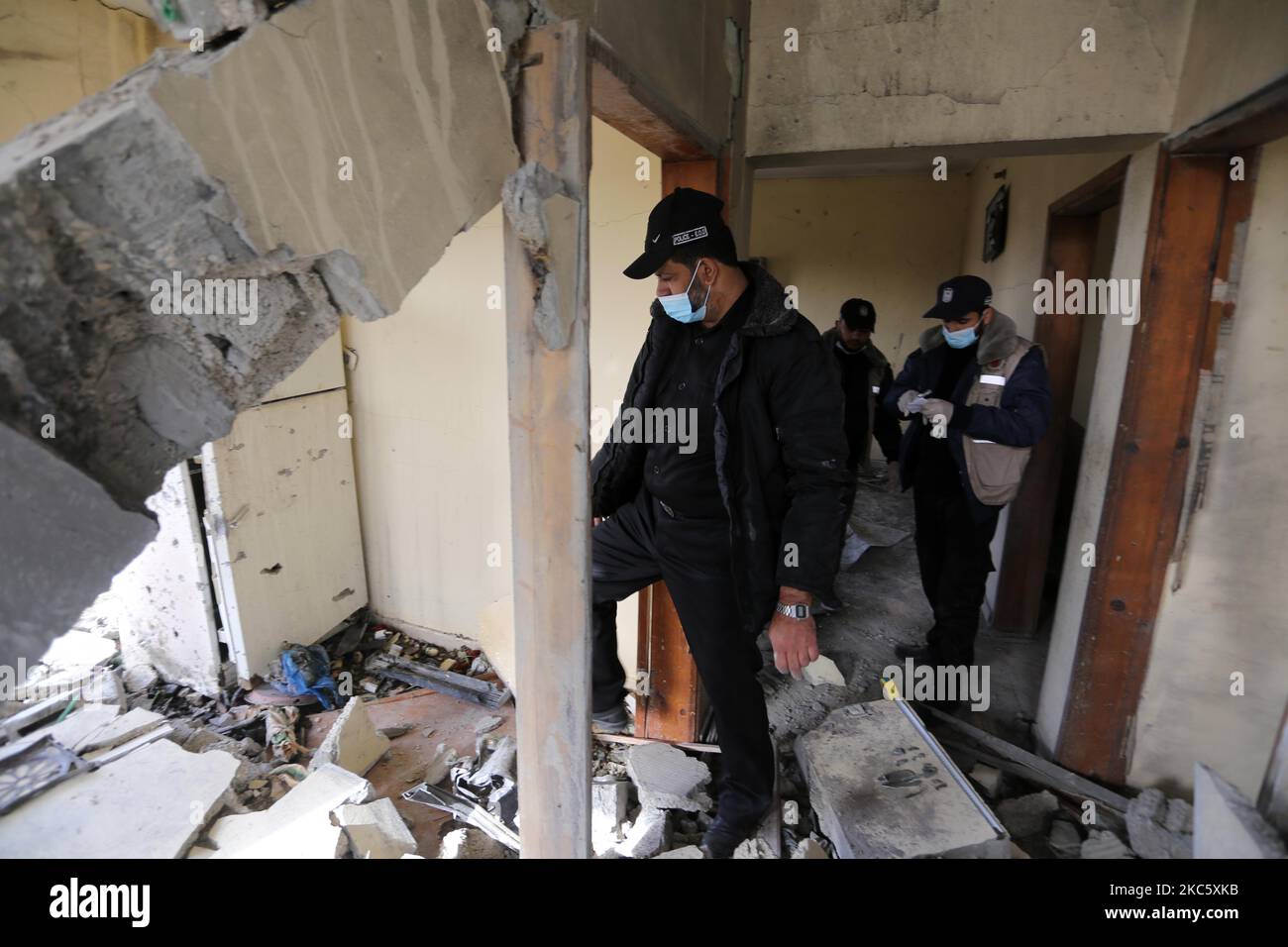 Members of the Palestinian civil defence inspect of a house east of Gaza City on December 15, 2020 following Israeli artillery shelling. (Photo by Majdi Fathi/NurPhoto) Stock Photo