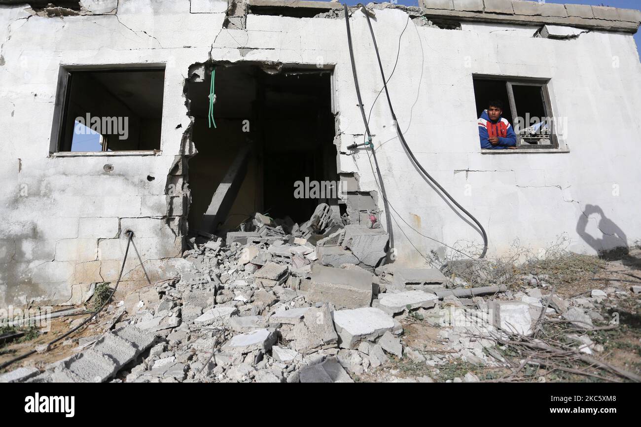 A Palestinian man inspects a house east of Gaza City on December 15, 2020 following Israeli artillery shelling. (Photo by Majdi Fathi/NurPhoto) Stock Photo