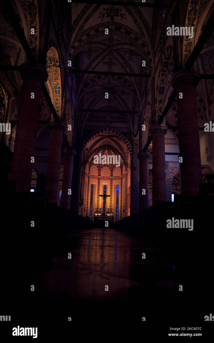 A vertical shot of an interior of a church in the evening Stock Photo ...