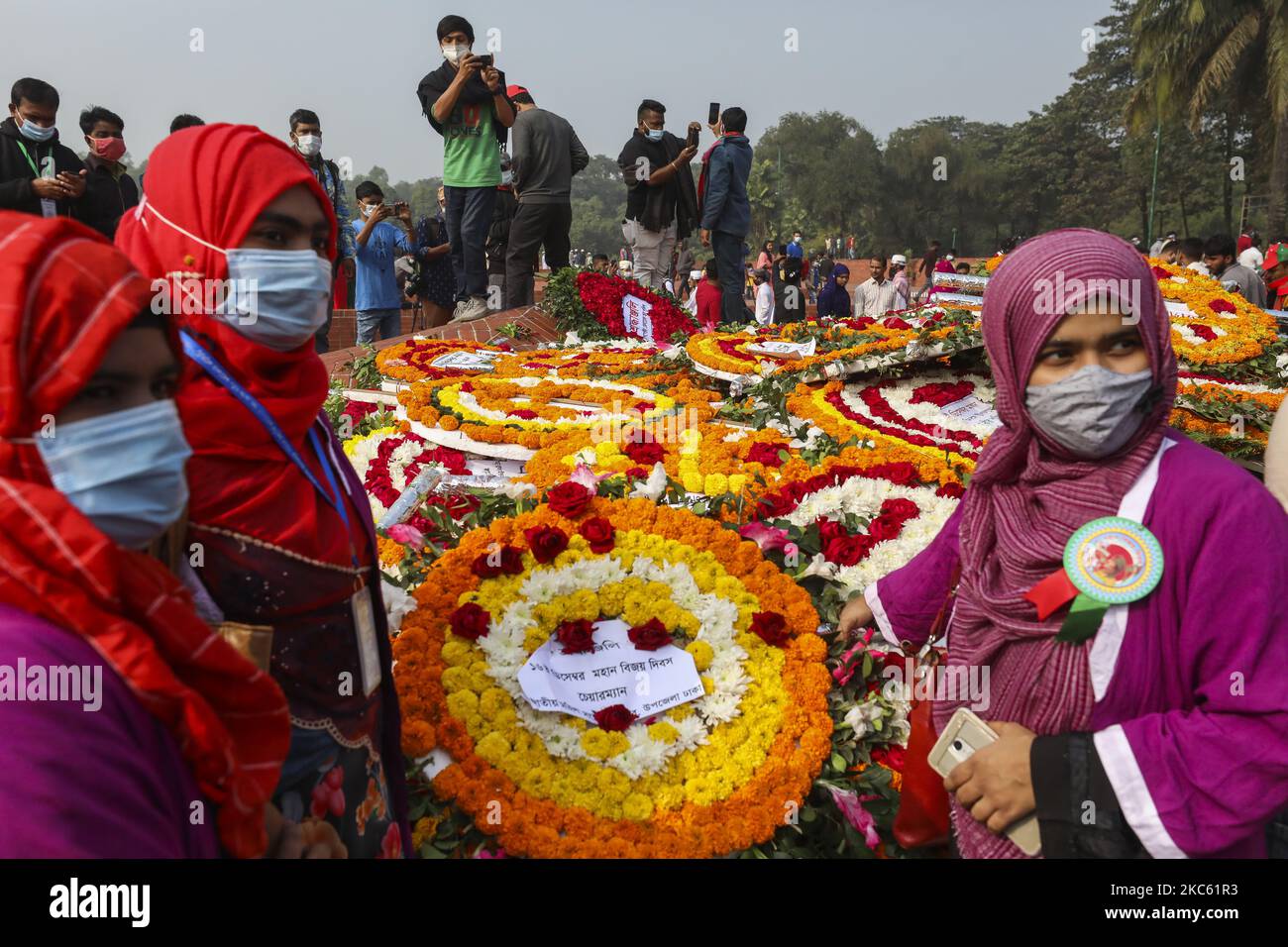 People gather to pay their respect at the national memorial of the 1971
