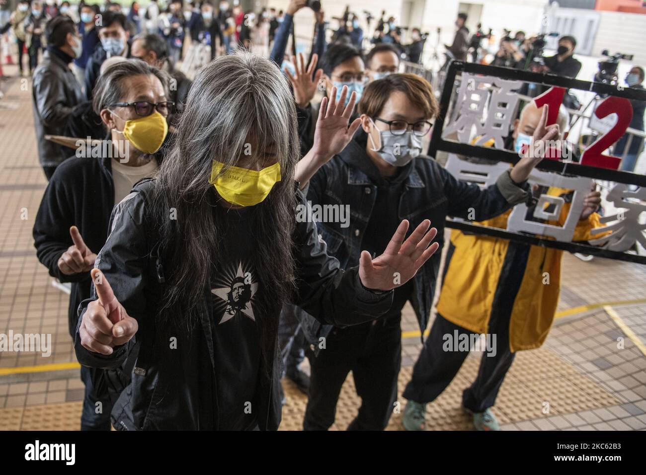 â€œLong Hairâ€ Leung Kwok-hung (M) and Figo Chan(R) are seen entering the West Migrants Court on December 17, 2020 in Hong Kong, China. Leung Kowk-Hung , Figo Chan, Tsang Kin-Shing , former lawmaker Eddie Chu and Wu Chi-wai are all charge with crimes related to the Anti-National Security Protest on July 1, 2020 . (Photo by Vernon Yuen/NurPhoto) Stock Photo