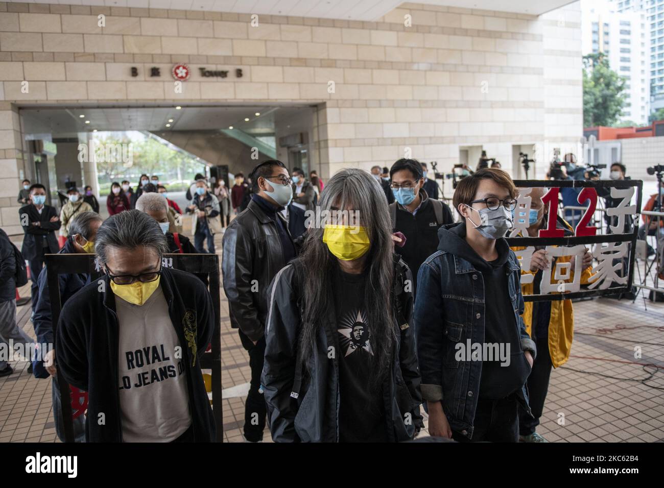 â€œLong Hairâ€ Leung Kwok-hung (M) and Figo Chan(R) are seen entering the West Migrants Court on December 17, 2020 in Hong Kong, China. Leung Kowk-Hung , Figo Chan, Tsang Kin-Shing , former lawmaker Eddie Chu and Wu Chi-wai are all charge with crimes related to the Anti-National Security Protest on July 1, 2020 . (Photo by Vernon Yuen/NurPhoto) Stock Photo