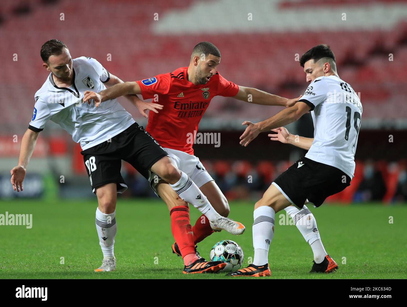 Adel Taarabt of SL Benfica with Nicolas Janvier and Pepelu of Vitoria SC in action during the Portuguese League Cup match between SL Benfica and Vitoria SC at Estadio da Luz on December 16, 2020 in Lisbon, Portugal.(Photo by Paulo Nascimento/NurPhoto) Stock Photo