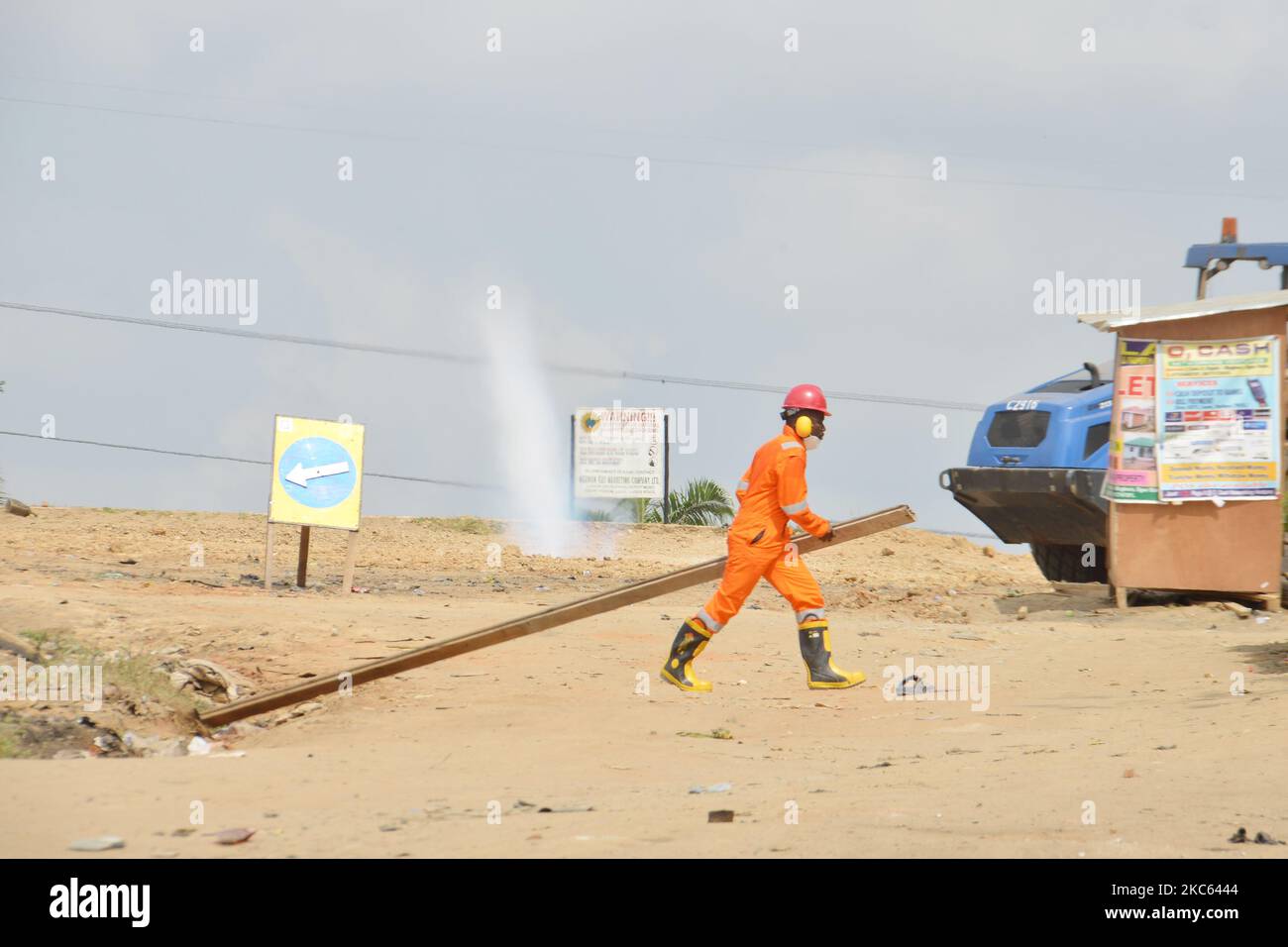 An NNPC personal barricading roads at the scene of a gas leak located around Magboro area of Ogun state was ruptured while Julius Berger Company was carrying out construction works along Lagos-Ibadan Expressway, Ogun State, Nigeria on December 16, 2020. (Photo by Olukayode Jaiyeola/NurPhoto) Stock Photo