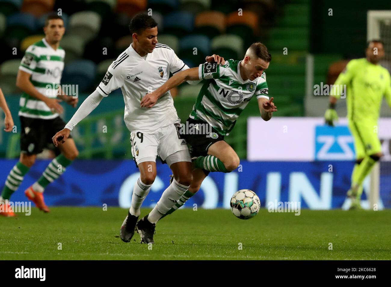 Nuno Santos of Sporting CP (R ) vies with Claudio Falcao of SC Farense during the Portuguese League football match between Sporting CP and SC Farense at Jose Alvalade stadium in Lisbon, Portugal on December 19, 2020. (Photo by Pedro FiÃºza/NurPhoto) Stock Photo