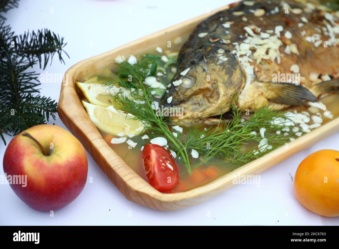A traditional jellied carp and other Polish Christmas dishes are presented  at the Main Square during the 24th edition of the Christmas Eve for poor  and homeless, organized byl local philanthropist and