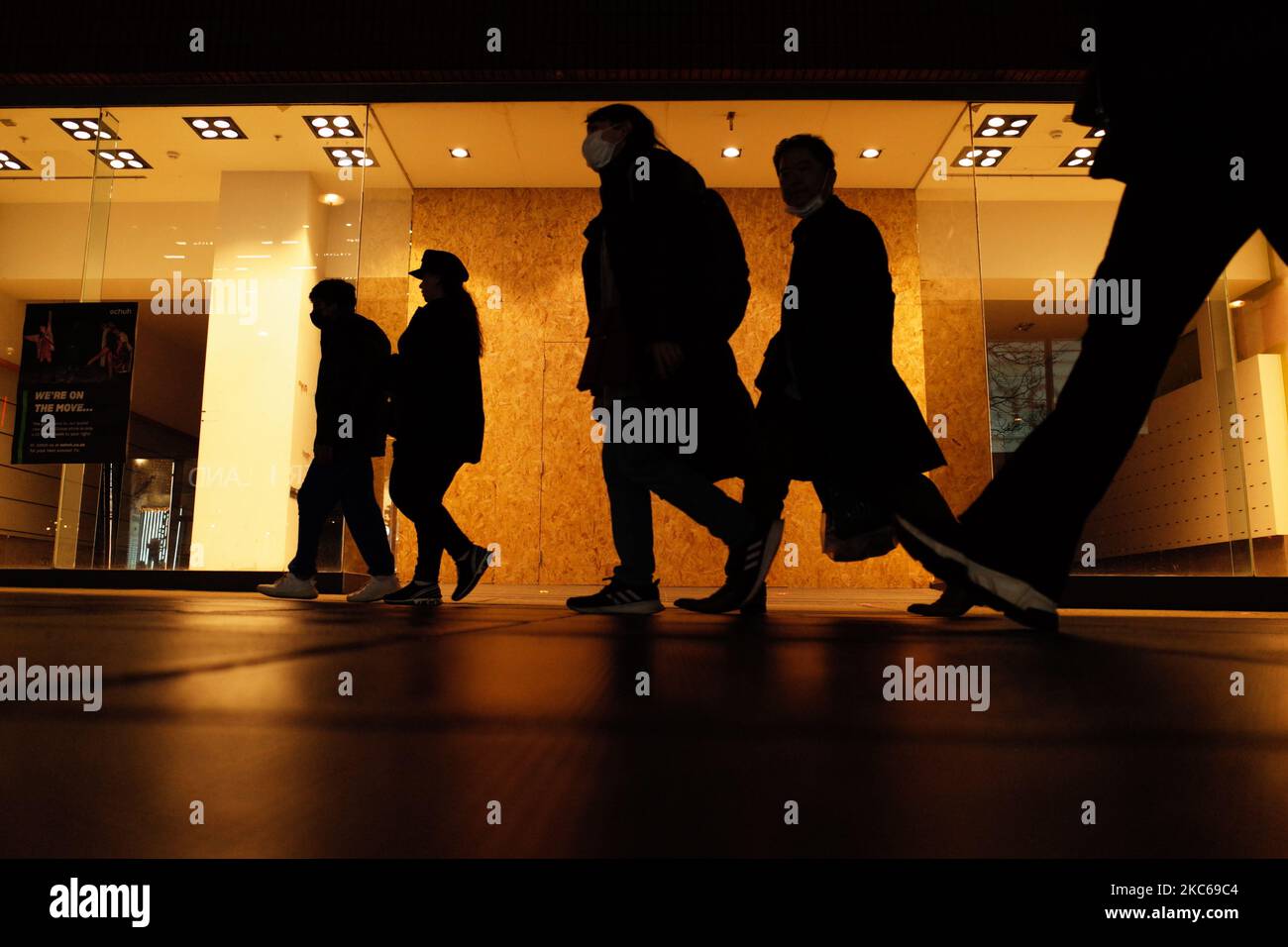 People walk past an empty retail unit on Oxford Street in London