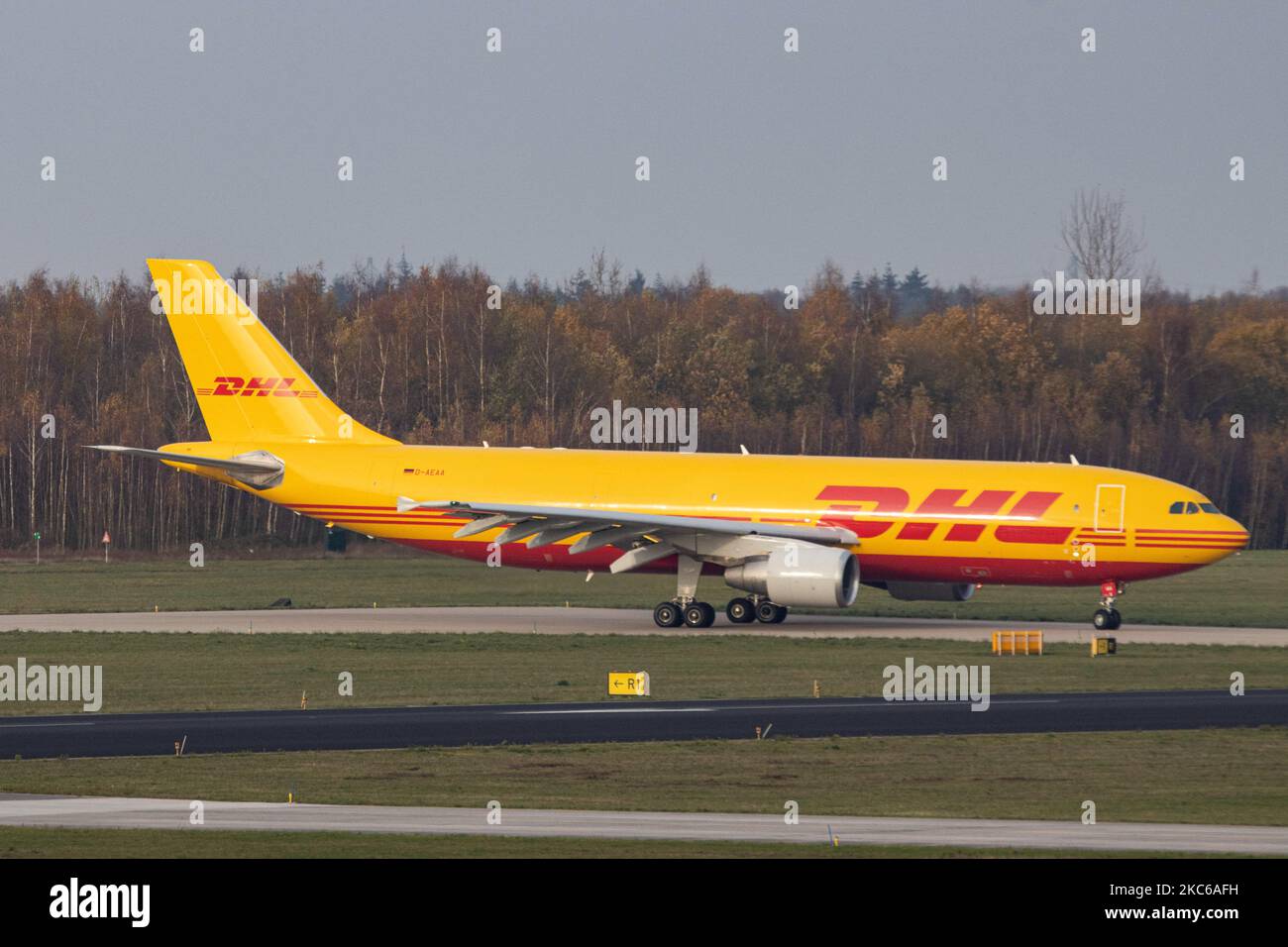 Airbus A300 DHL - EAT Leipzig cargo freight aircraft as seen taxiing, departing and flying from Eindhoven Airport EIN EHEH. The wide-body Airbus A300-600(F) airplane has the registration D-AEAA. DHL Aviation, a division of DHL Express ( Dalsey, Hillblom and Lynn) International GmbH is a German courier, parcel, and express mail service which is a division of the German logistics company Deutsche Post DHL. The world passenger traffic declined during the coronavirus covid-19 pandemic era with the industry struggling to survive in contrast with the freight and cargo airlines that are thriving. Ein Stock Photo