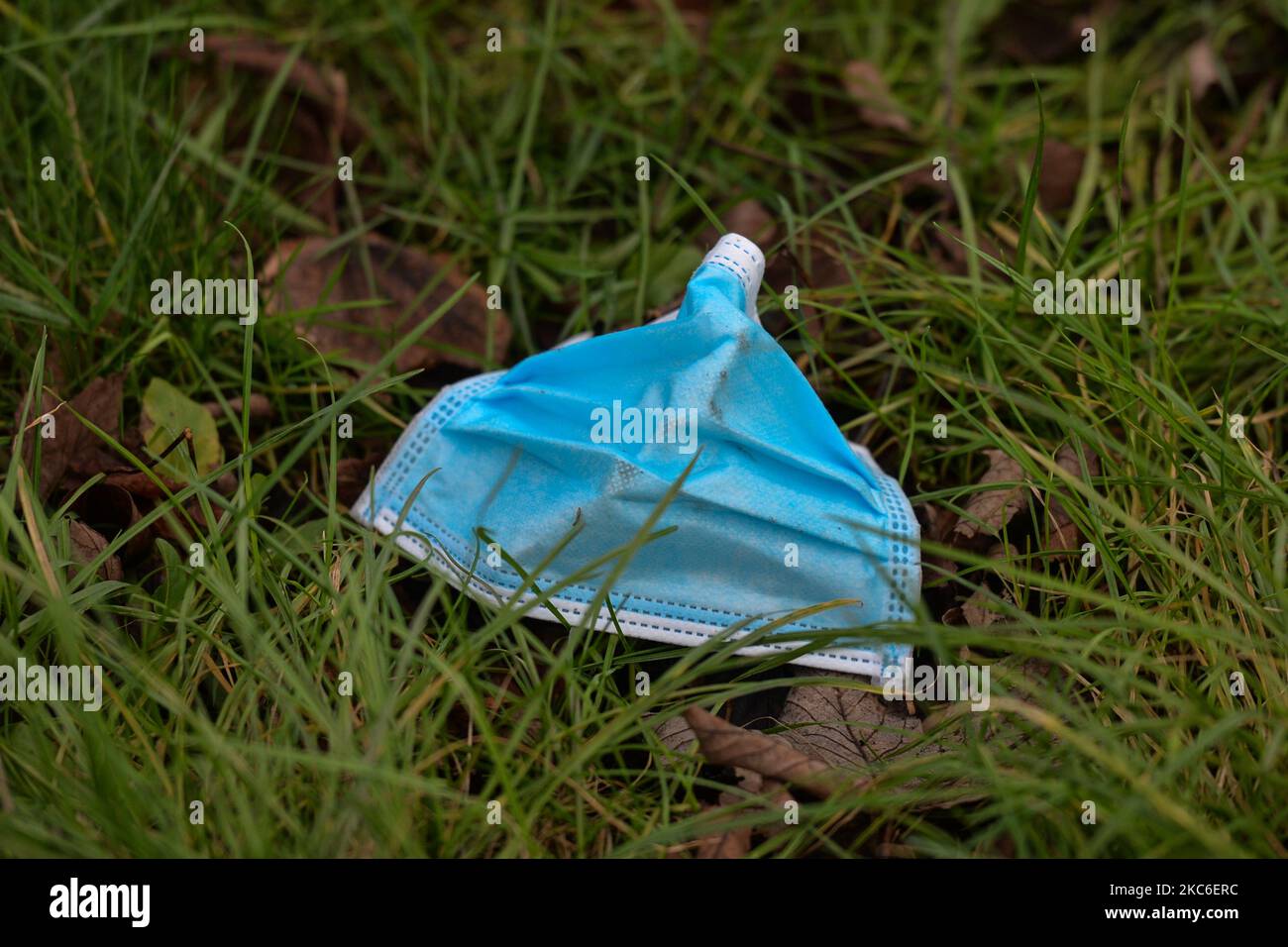 A face mask left on a side of a path seen in Dublin city center. On
