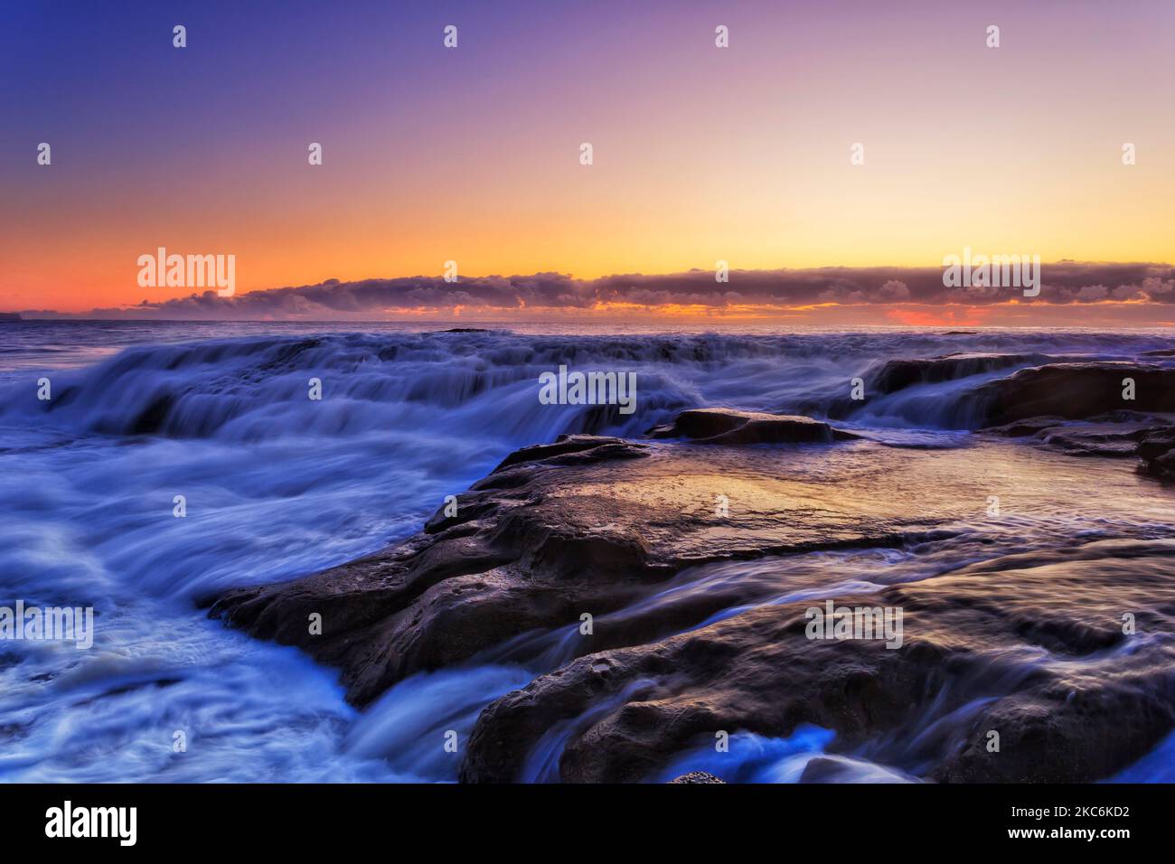 Scenic colourful seascape sunrise at Whale beach of Sydney Pacific ocean coast at Northern Beaches. Stock Photo