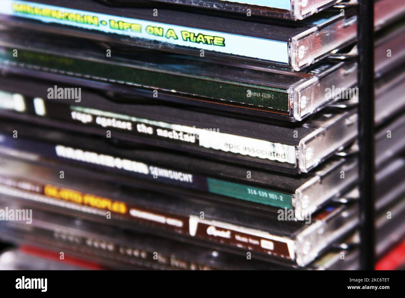 A closeup of stacked CD's with various titles Stock Photo