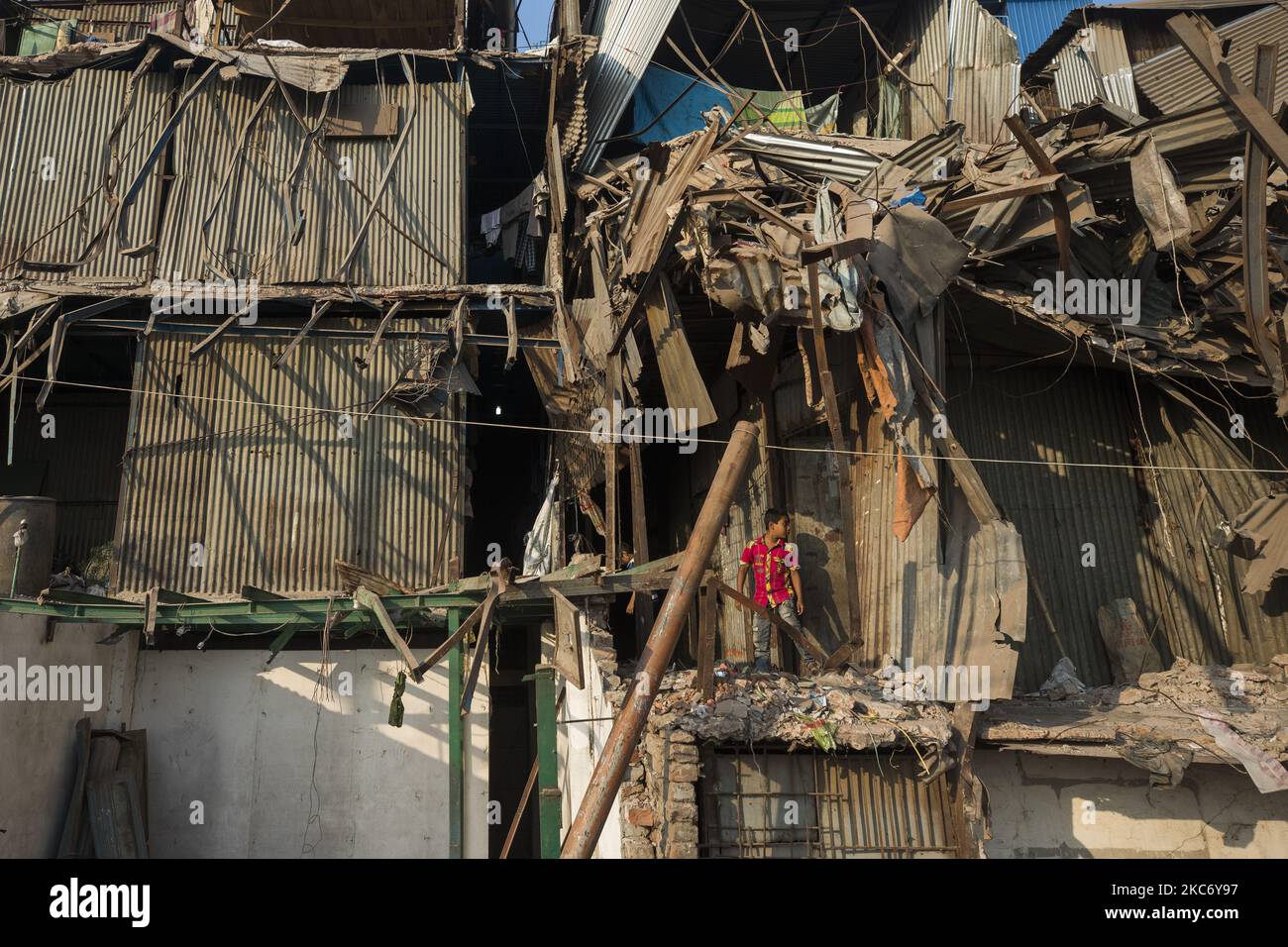 A boy seen walks through a demolished illigal establishment in the bank of Buriganga River in Dhaka on January 4, 2021. (Photo by Ahmed Salahuddin/NurPhoto) Stock Photo
