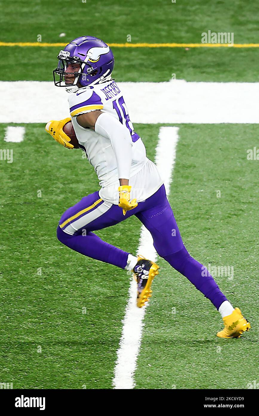 Minnesota Vikings wide receiver Justin Jefferson (18) carries the