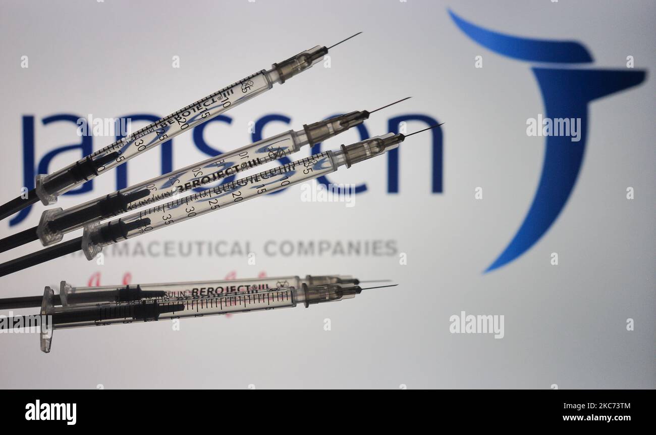 An illustrative image of medical syringes in front of Janssen Pharmaceutica logo displayed on a screen. On Friday, January 8, 2020, in Dublin, Ireland. (Photo by Artur Widak/NurPhoto) Stock Photo