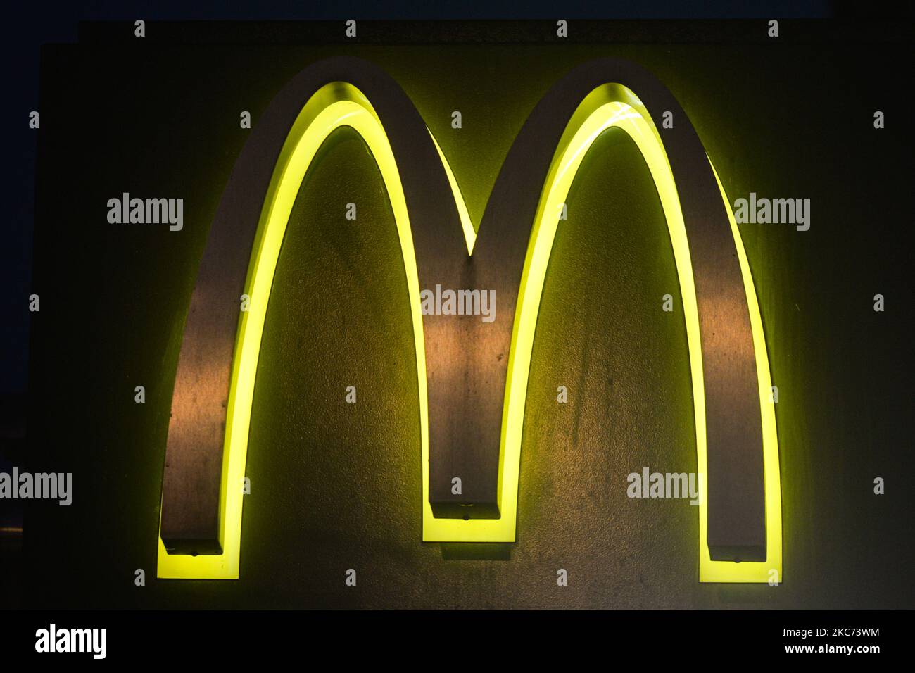 McDonald's logo visible in front of an open McDonald's restaurant in