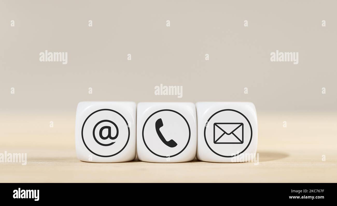 Contact us icons on white cube blocks. Copy space Stock Photo - Alamy
