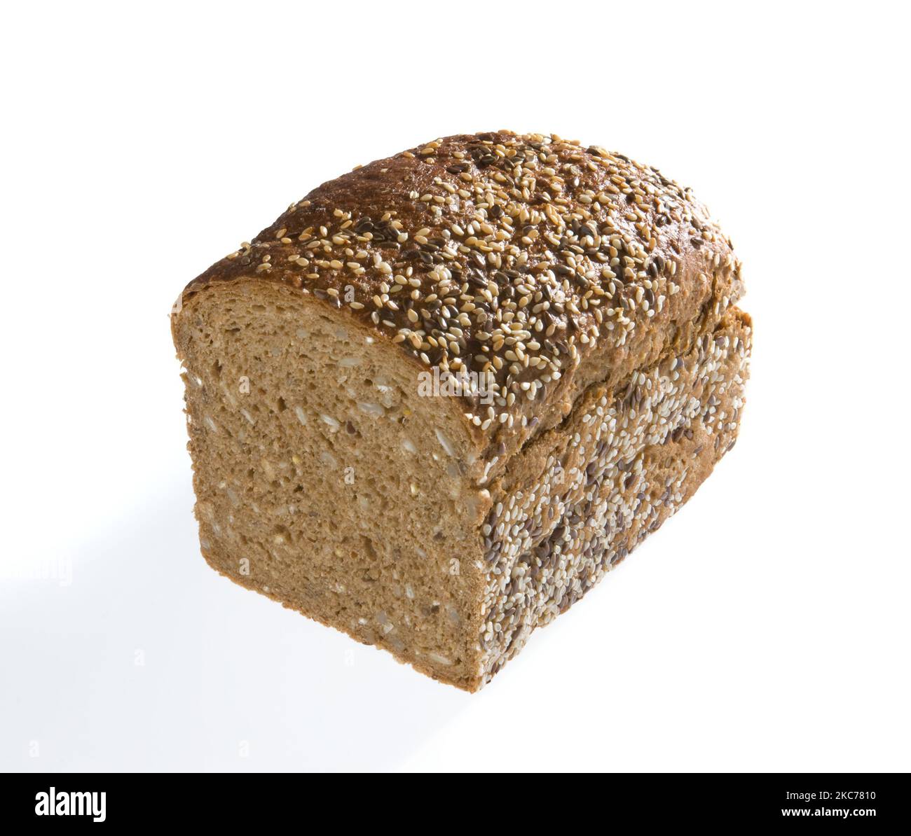 A slice of brown bread with sesame seeds isolated on a white background ...