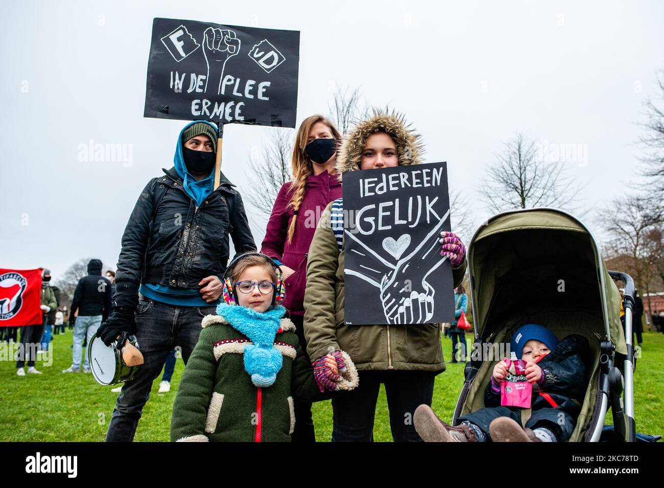 A whole family is holding placards against racism, during a demonstration against fascism in Amsterdam, Netherlands on January 10th, 2021. After the 'attempted coup' at the US Capitol building that left five people dead, several organizations in Amsterdam organized a demonstration against fascism. Hundreds of people gathered at the Westerpark to protest against the rise of the far-right movement in Europe and in the USA. (Photo by Romy Arroyo Fernandez/NurPhoto) Stock Photo