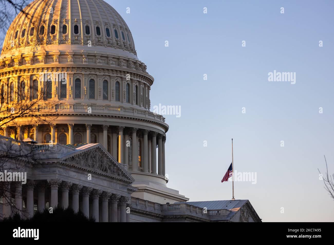 A flag flies at half staff to honor slain Capitol Police Officer Brian Sicknick at the US Capitol building on Capitol Hill in Washington, D.C., January 10, 2021. (Photo by Aurora Samperio/NurPhoto) Stock Photo