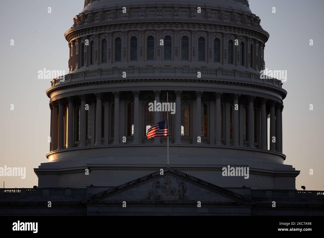 A flag flies at half staff to honor slain Capitol Police Officer Brian Sicknick at the US Capitol building on Capitol Hill in Washington, D.C., January 10, 2021. (Photo by Aurora Samperio/NurPhoto) Stock Photo