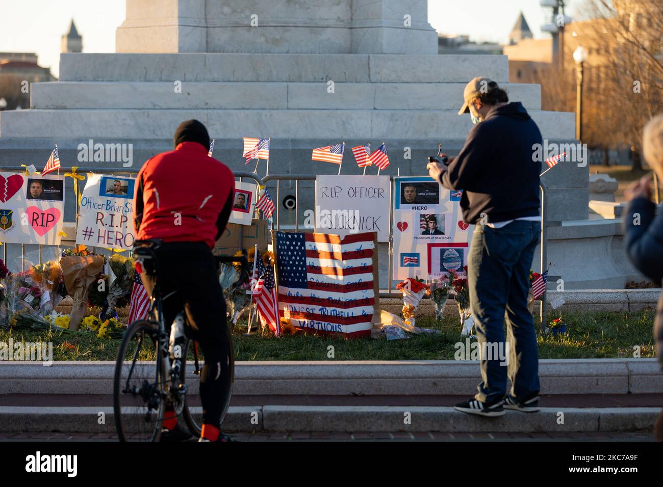 Flowers and candles are seen at a memorial for the dead people at the US Capitol after US President Donald Trump's supporters stormed the building, in Washington, D.C. January 10, 2021. (Photo by Aurora Samperio/NurPhoto) Stock Photo