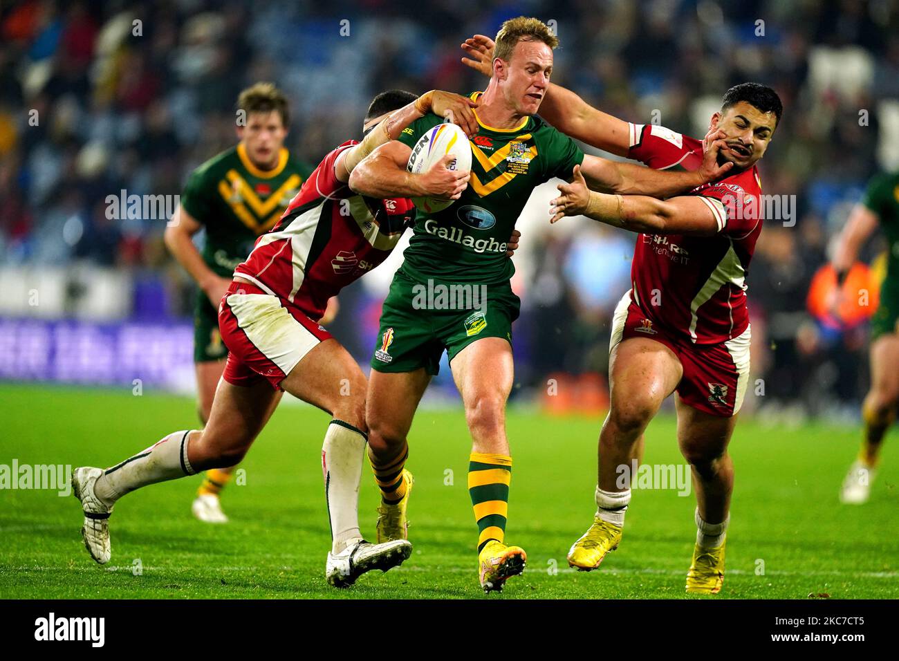 Australia's Daly Cherry-Evans (centre) is tackled by Lebanon's Jaxson ...
