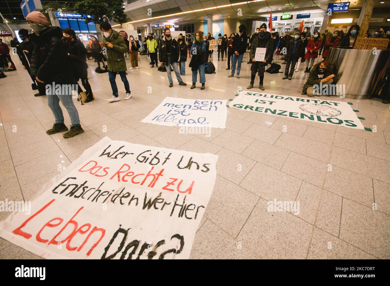 ' who gives us right to decide who can live here' is seen during the rally against deportation the refugees back to Afghanistan in Duesseldorf airport, in Duesseldorf, Germany, on January 12, 2021. (Photo by Ying Tang/NurPhoto) Stock Photo