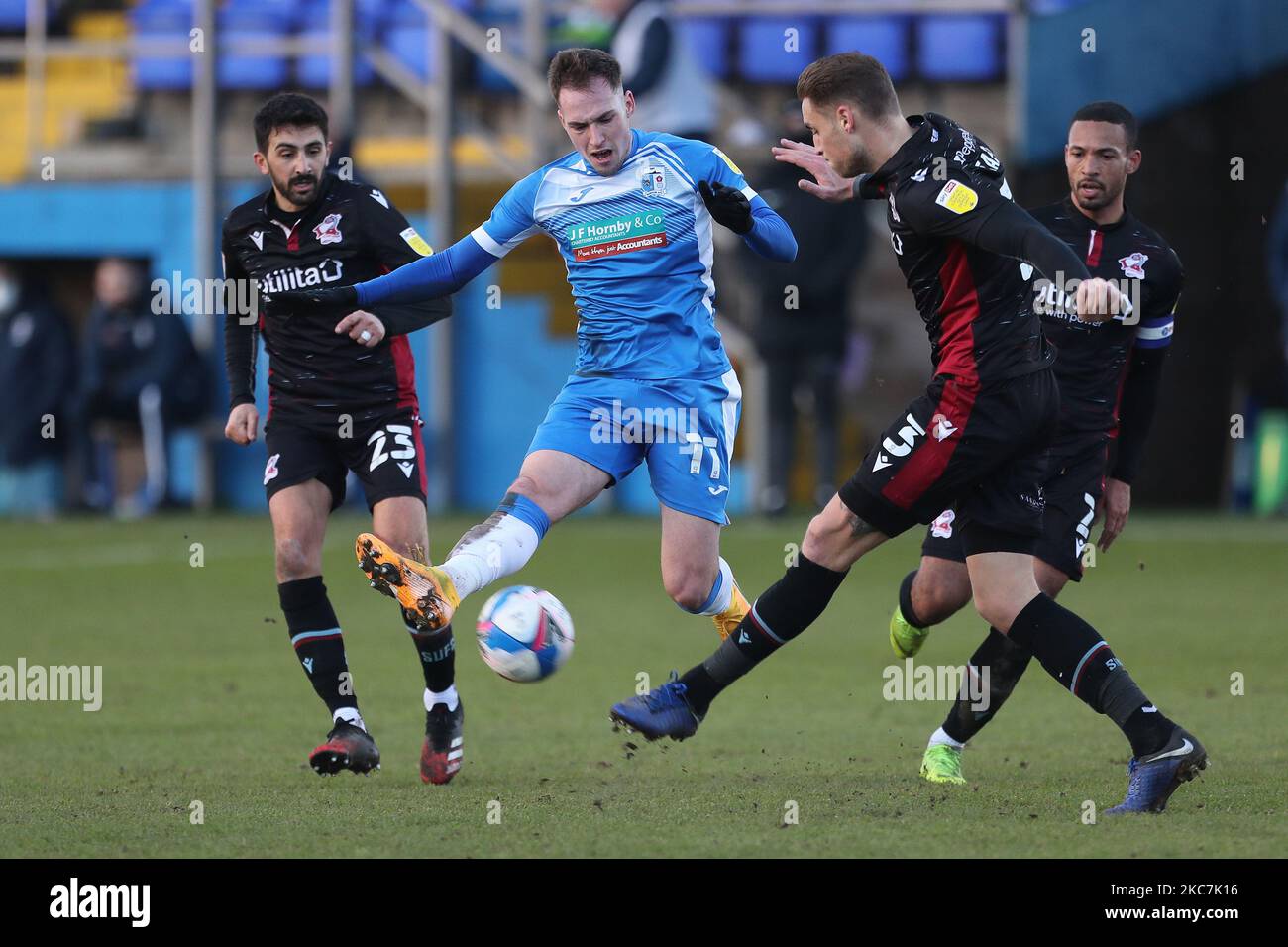 Barrow's Josh Kay in action with Frank Vincent and George Tait during the Sky Bet League 2 match between Barrow and Scunthorpe United at the Holker Street, Barrow-in-Furness, England on 16th January 2021. (Photo by Mark Fletcher/MI News/NurPhoto) Stock Photo