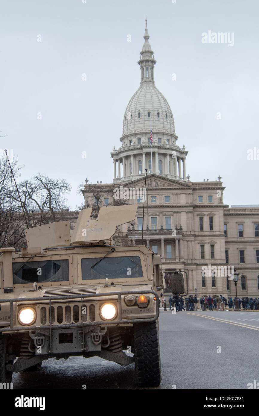 National Guard members were sent in to support Michigan State Police and Lansing Police in anticipation for armed protests at the Michigan State Capitol in Lansing, Michigan on January 17, 2021. A gathering of a few dozen armed and unarmed protestors attended, some fervent Trump supporters, others not, culminated in a speech by members of the Boogaloo Bois standing alongside BLM protestors calling for unity and stating, “If you (government) continue to oppress the American people, they will remain rational no longer.” (Photo by Adam J. Dewey/NurPhoto) Stock Photo
