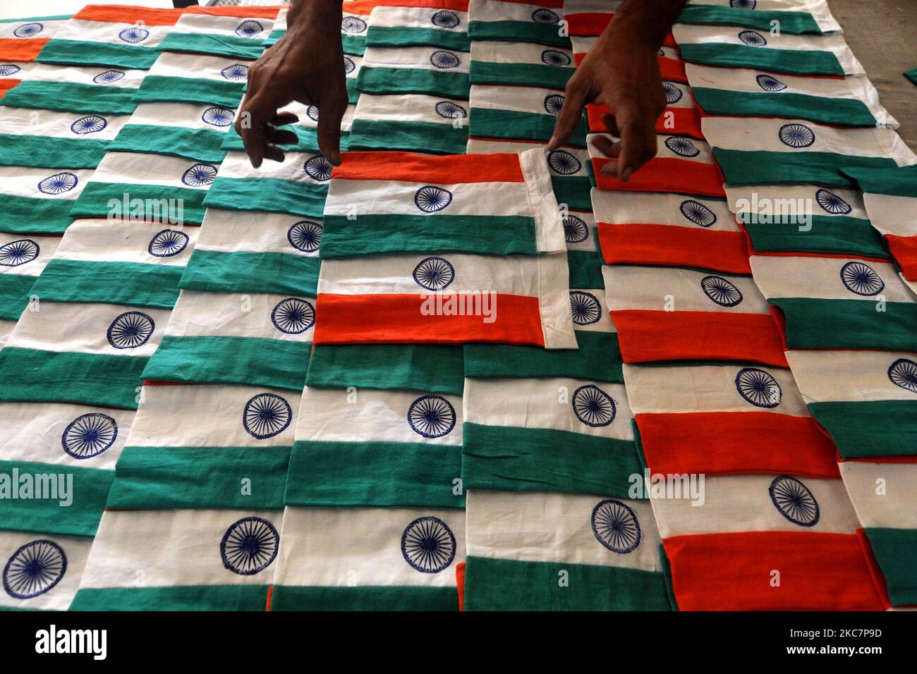 Employees of the Assam Khadi and Village Industries Board during the process of making Indian national flags, ahead of the celebrations of the IndianÂ Republic day in Guwahati on January 18,2021. (Photo by Anuwar Hazarika/NurPhoto) Stock Photo