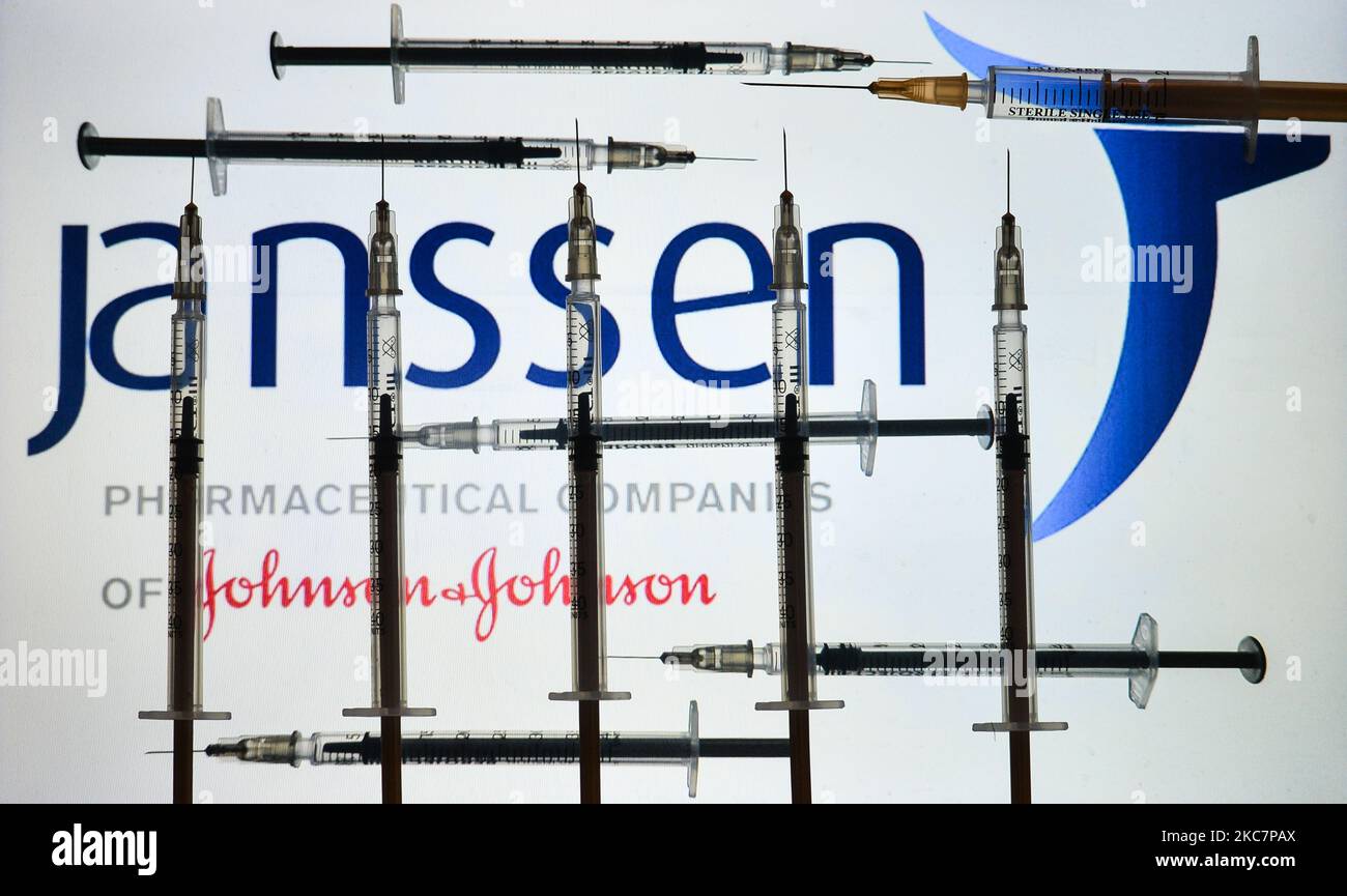 An illustrative image of medical syringes in front of Janssen Pharmaceutica, and Johnson and Johnson logos displayed on a screen. On Monday, January 18, 2021, in Dublin, Ireland. (Photo by Artur Widak/NurPhoto) Stock Photo