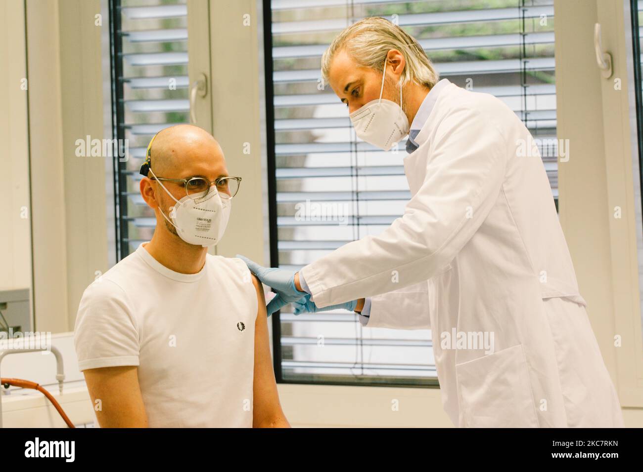 A medical staff administrates the moderna vaccine to steffen Veen, a