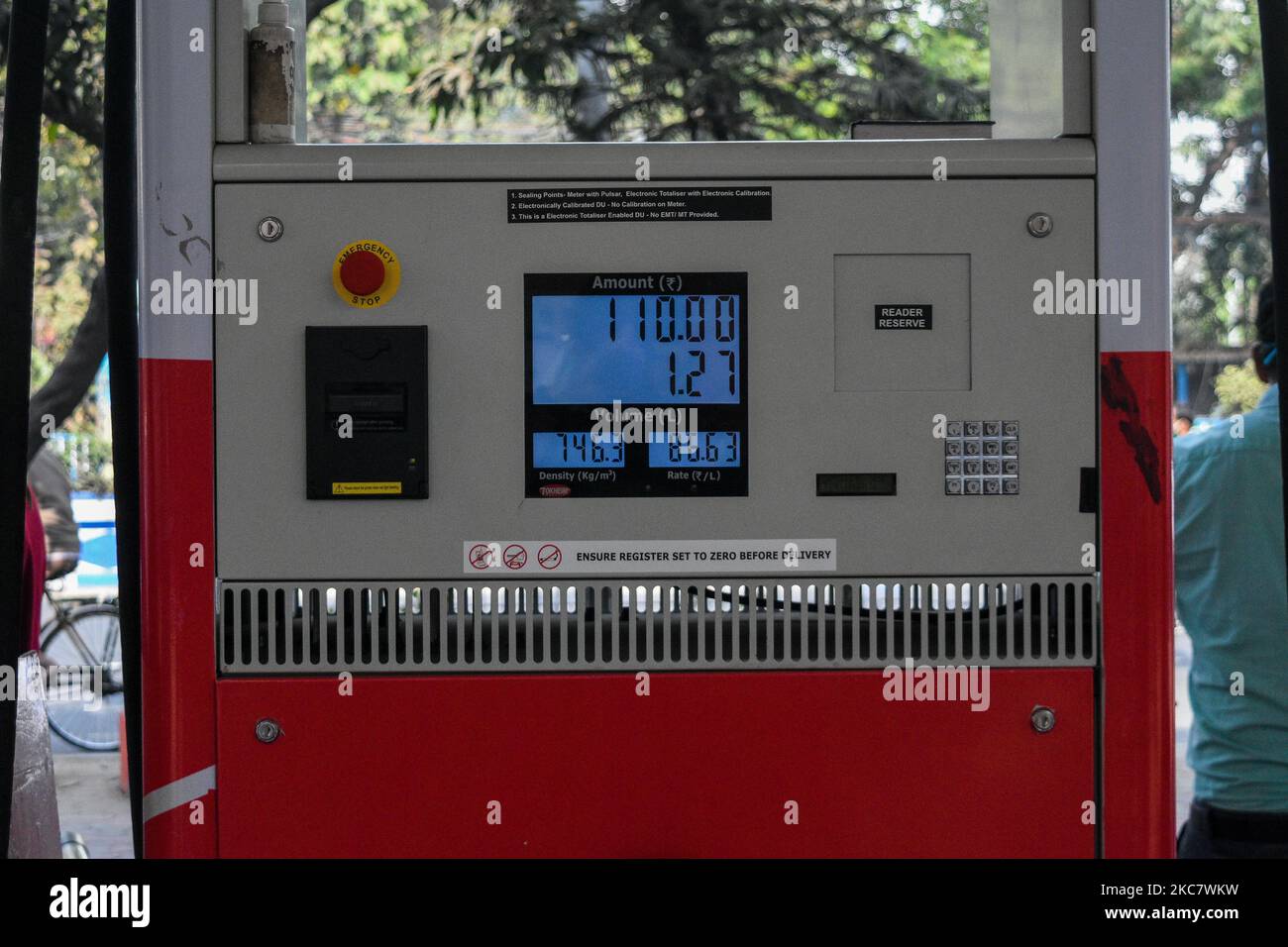 A petrol pump displaying the new hiked petrol price at a fule station