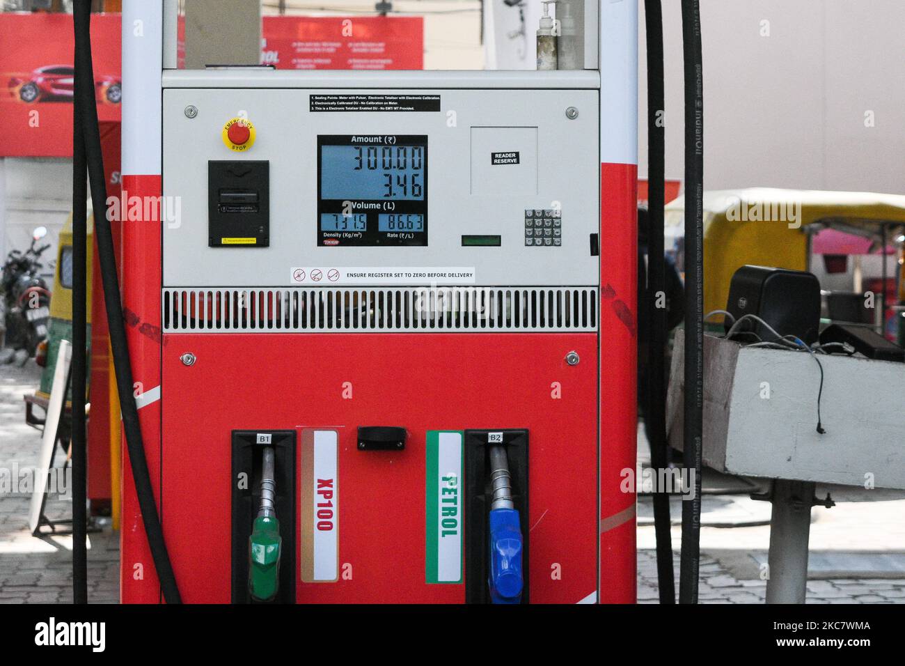A petrol pump displaying the new hiked petrol price at a fule station