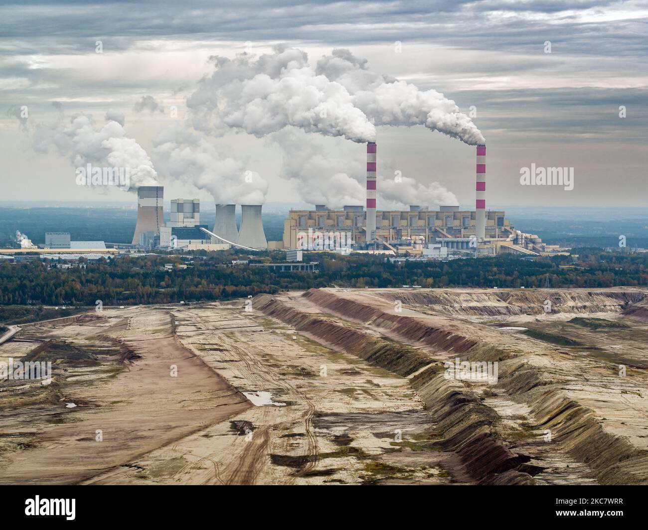 Aerial view of power plant and open-cast coal mine in Belchatow under moody cloudy sky, Poland Stock Photo
