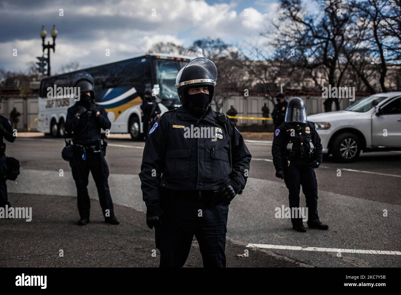 Police officers stand guard as the two trump supporters were haggled by ...