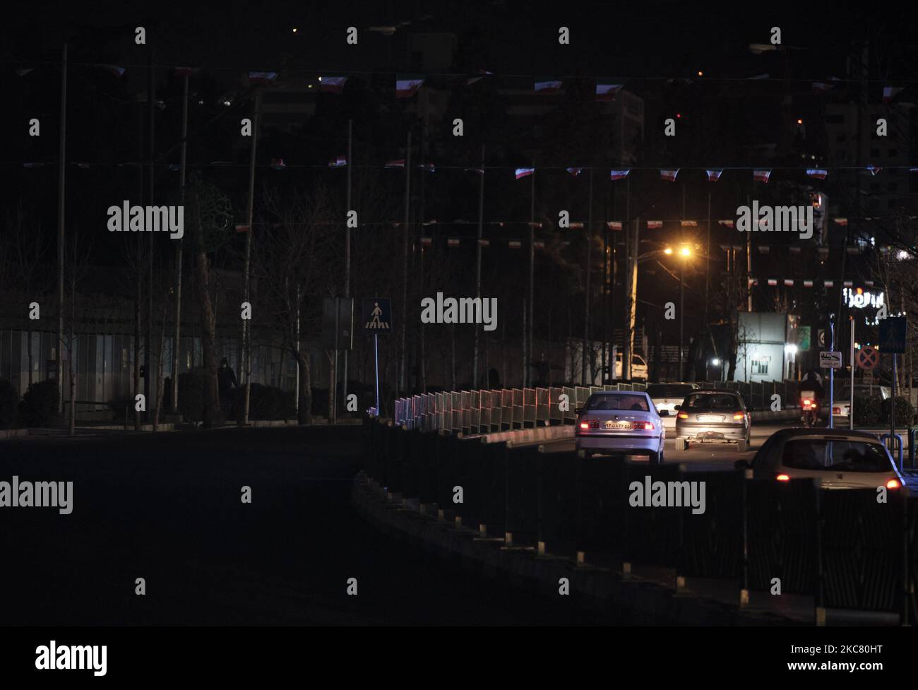 A view of an avenue while power blackouts in northern Tehran at night ...