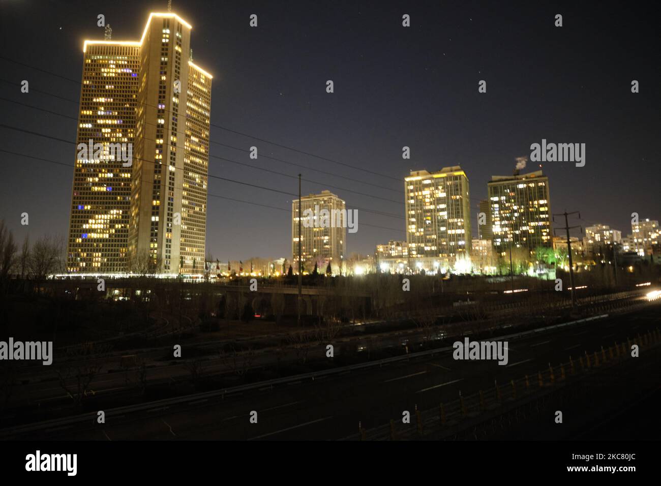 Residential complexes are pictured as a road is seen while power ...