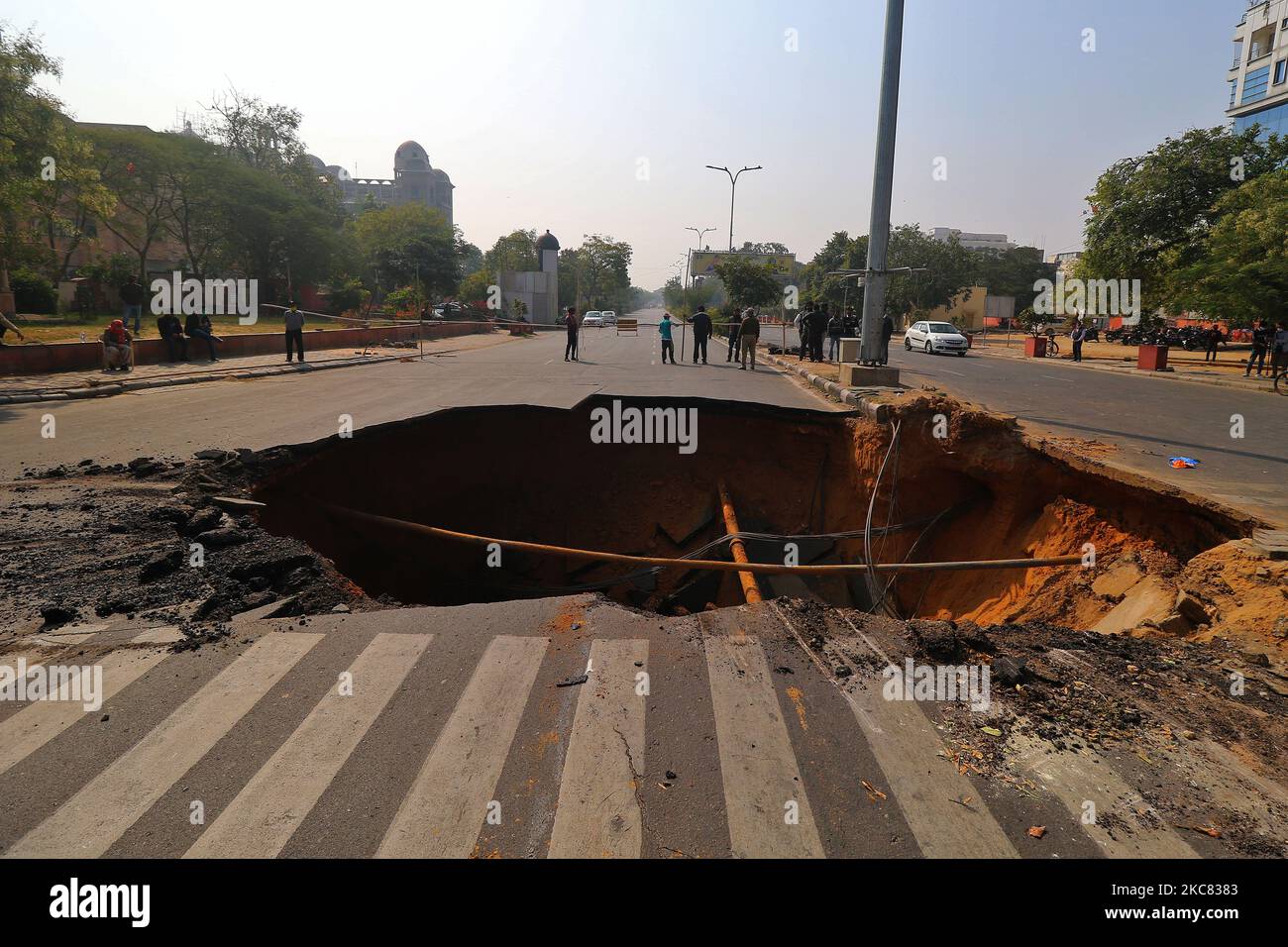 A sinkhole after a portion of a road collapsed at Chomu Circle, in Jaipur, Rajasthan,India, Saturday, Jan. 23, 2021.(Photo by Vishal Bhatnagar/NurPhoto) Stock Photo