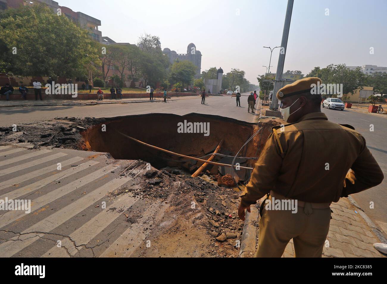 A sinkhole after a portion of a road collapsed at Chomu Circle, in Jaipur, Rajasthan,India, Saturday, Jan. 23, 2021.(Photo by Vishal Bhatnagar/NurPhoto) Stock Photo
