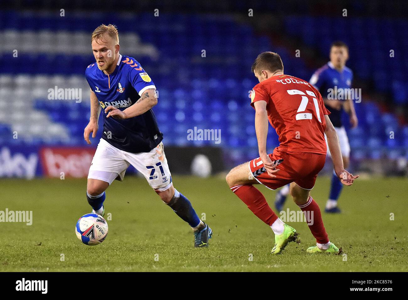 Oldham Athletic's Marcel Hilssner tussles with Lewis Collins of Newport County during the Sky Bet League 2 match between Oldham Athletic and Newport County at Boundary Park, Oldham on Saturday 23rd January 2021. (Photo by Eddie Garvey/MI News/NurPhoto) Stock Photo