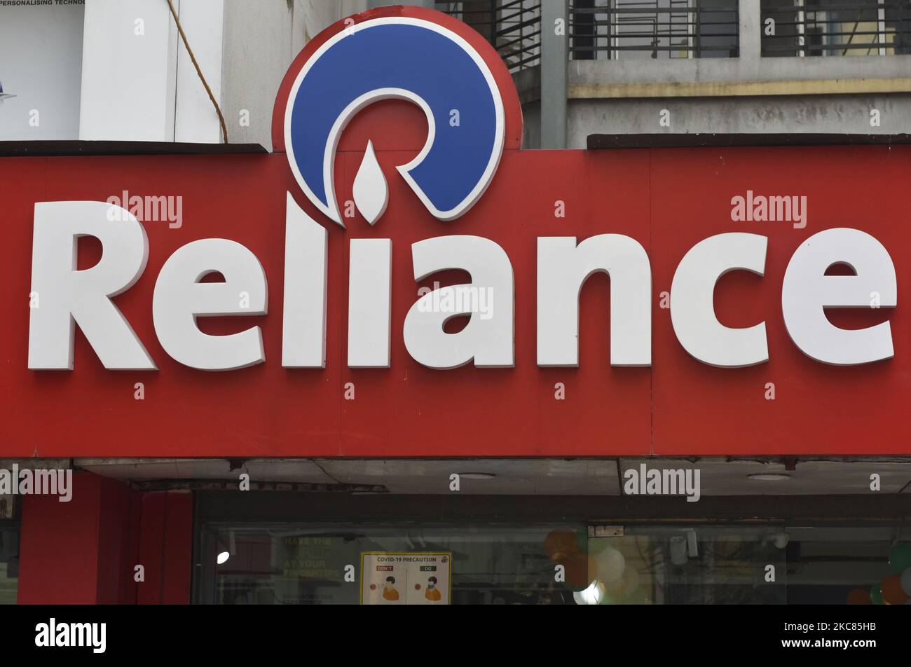 A Reliance logo can be seen in Kolkata, India, 25 January, 2021. Reliance Industries' profit jumped in the final quarter of 2020 as it reined in spending, although the Indian conglomerate recorded a sharp fall in revenue from its dominant oil-to-chemicals business according to an Indian media report. (Photo by Indranil Aditya/NurPhoto) Stock Photo
