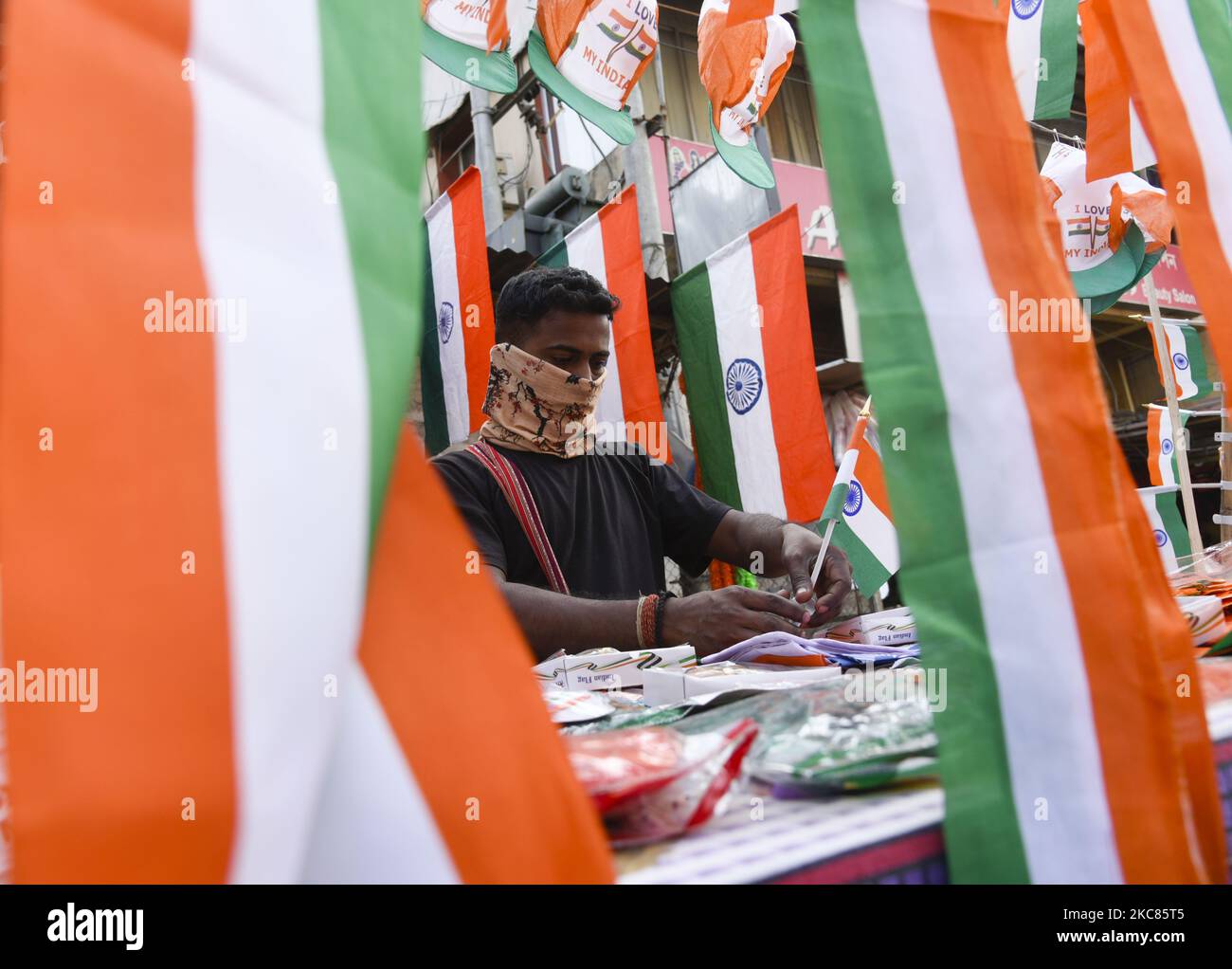 Street vendor selling tricolour in the eve of 71st Republic day, in Guwahati on 25 January 2021. Republic Day is celebrated every year in India on January 26 to commemorate the date on which the Constitution of India came into effect, in the year 1950, and the country became a republic. (Photo by David Talukdar/NurPhoto) Stock Photo