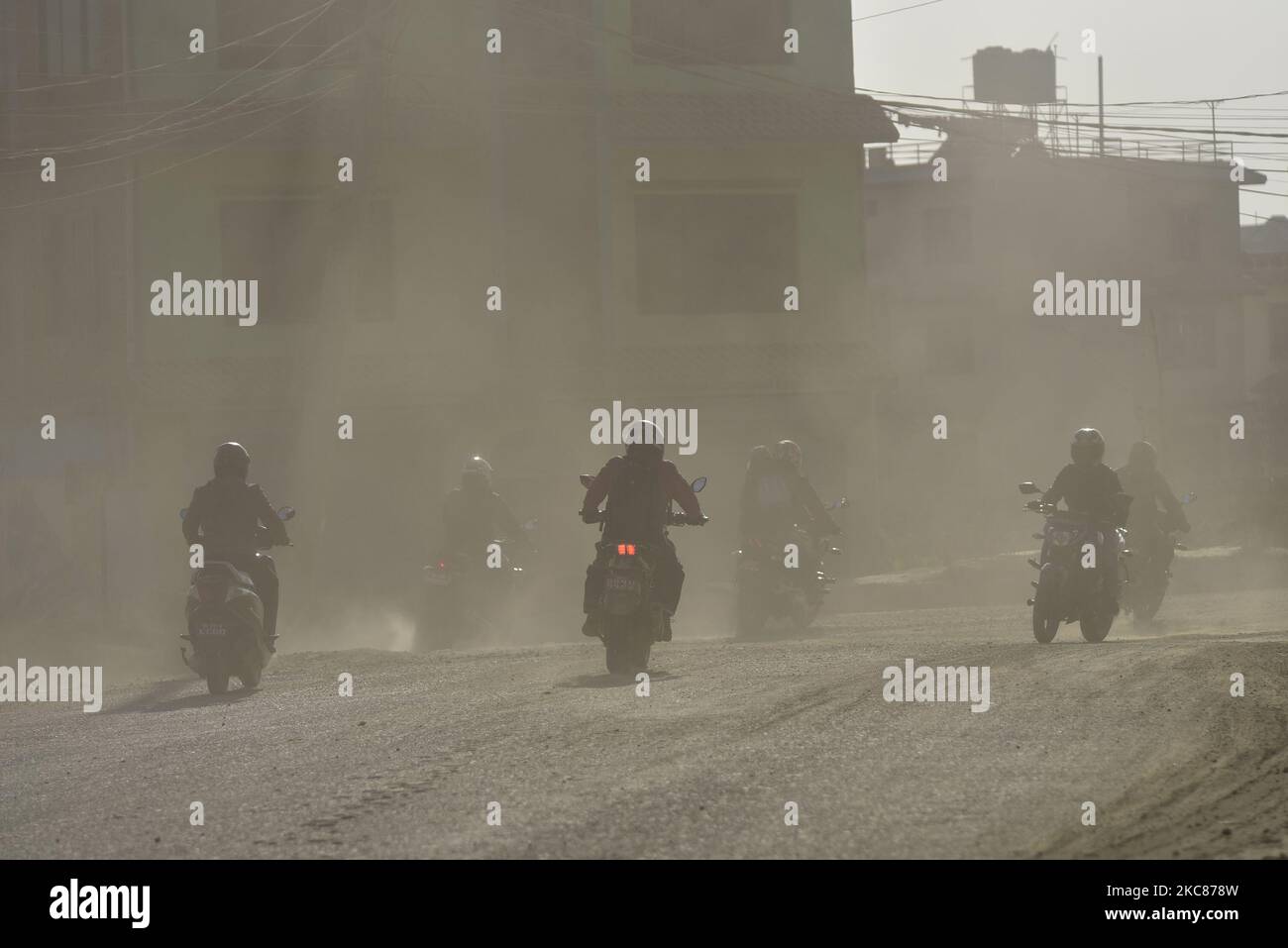 Bikers travelling through mass of dust and air pollution at Kathmandu, Nepal on Tuesday, January 26, 2021. Kathmandu has been ranked as the top 10 most polluted city in the world. (Photo by Narayan Maharjan/NurPhoto) Stock Photo