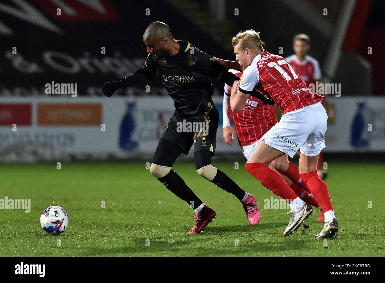 Oldham Athletic's Dylan Bahamboula tussles wit Lewis Freestone of Cheltenham Town during the Sky Bet League 2 match between Cheltenham Town and Oldham Athletic at the Abbey Business Stadium, Cheltenham on Tuesday 26th January 2021. (Photo by Eddie Garvey/MI News/NurPhoto) Stock Photo