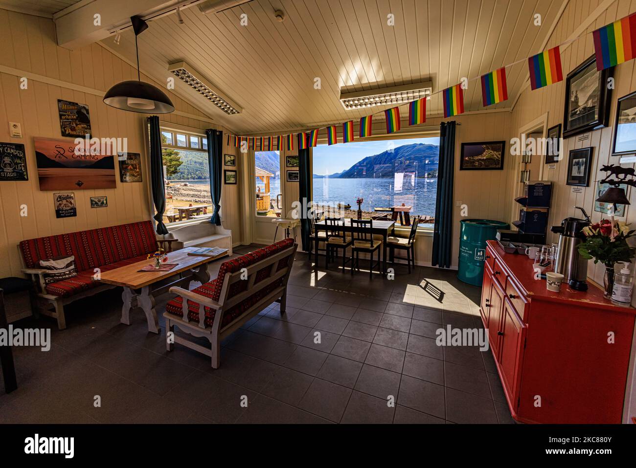 A beautiful small cafe in Sandviken Camping with a lake and mountains visible from the window Stock Photo