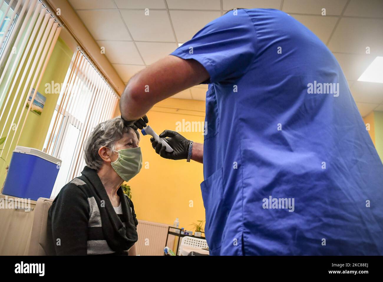 Uvotizen Injection Senior citizen receives an injection of Pfizer-BioNTech vaccine against ...