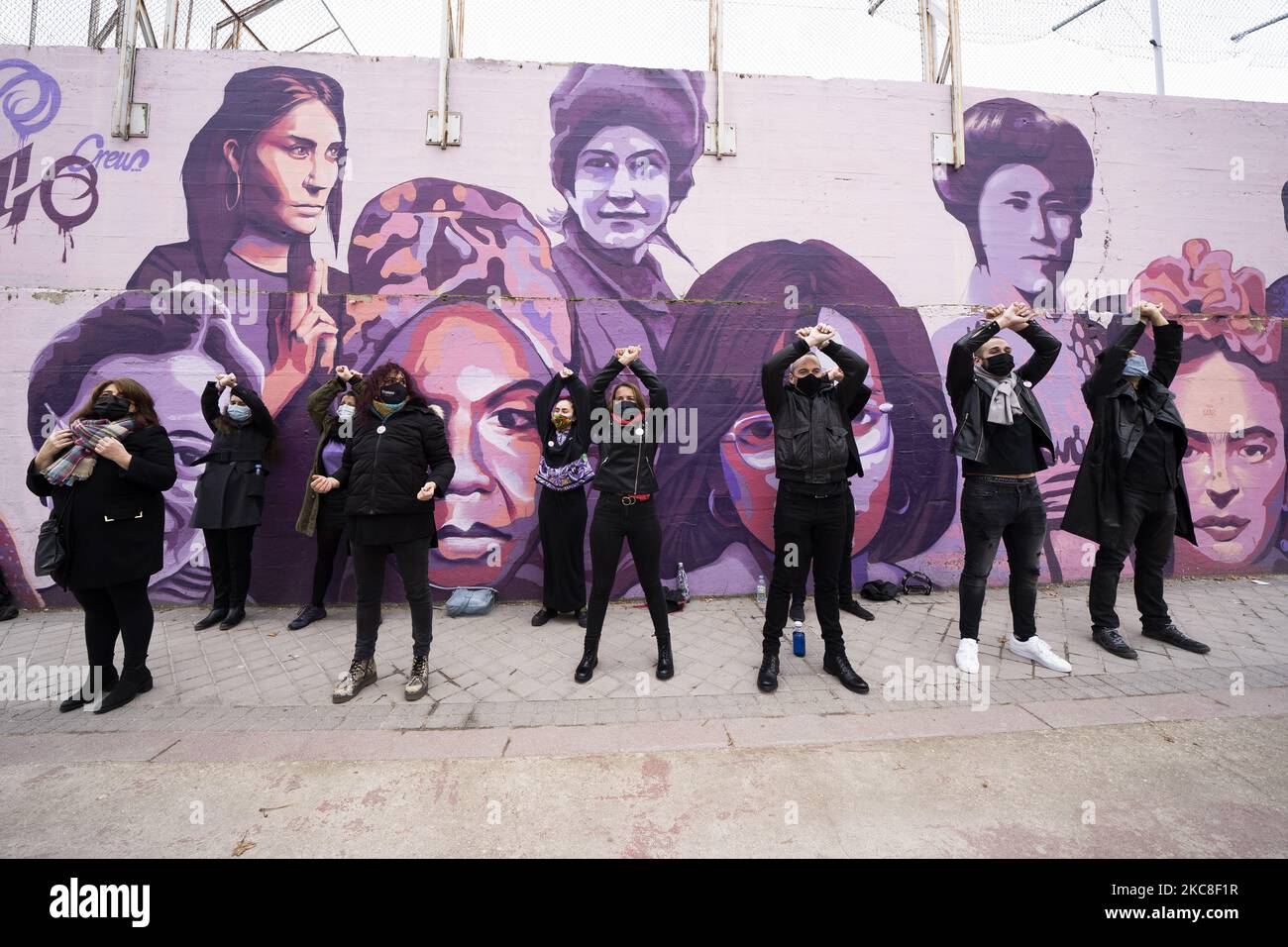 People walk past a mural in Madrid showing a diverse array of women from Nina Simone, and Rosa Parks to Frida Kahlo and the Red Army sniper Lyudmila Pavlichenko on January 31, 2021 in Madrid, Spain. The mural has been saved from destruction after city councillors stepped in to thwart far-right attempts to have it removed. (Photo by Oscar Gonzalez/NurPhoto) Stock Photo